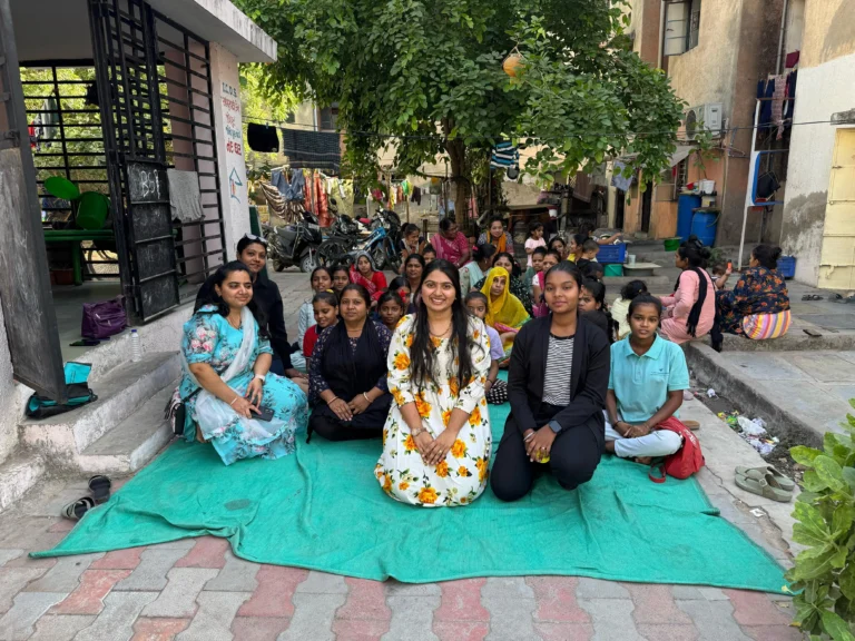 Volunteers with women at the hygiene drive in Gokul Awas, Jodhpur, Ahmedabad