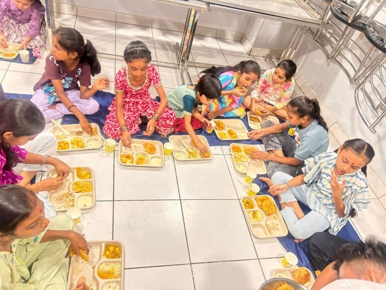 Young girls being served a meal at Kanya Pujan, Vastrapur, Ahmedabad
