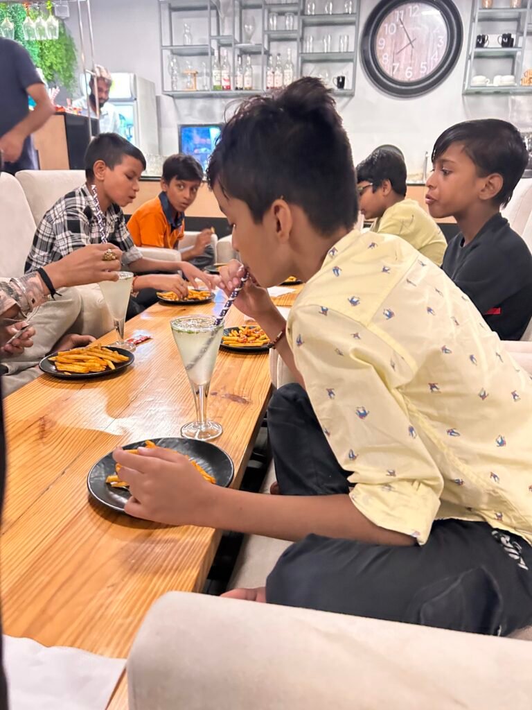 Boys enjoying pizza at the boys’ pizza party